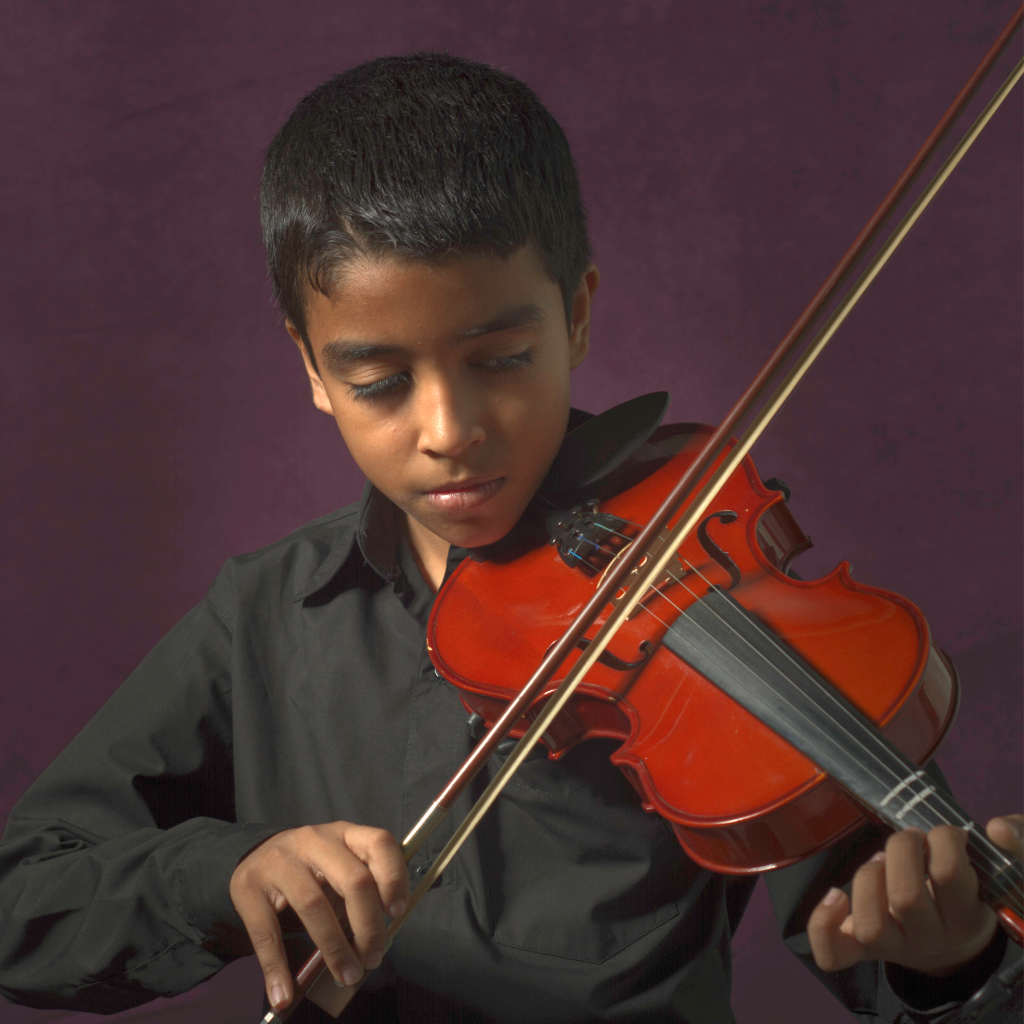 Los Cabos Music Violin Student playing his instrument